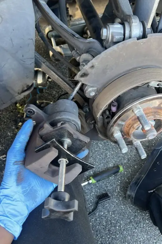 Compressing the caliper piston for new pads