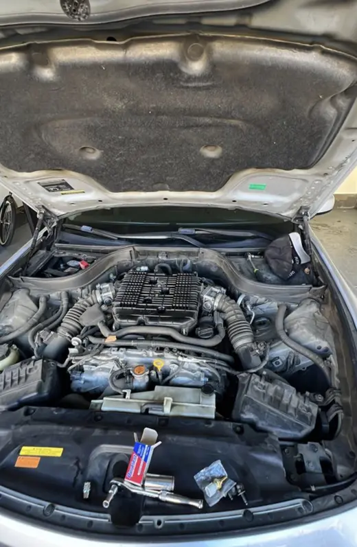 Infiniti V6, mid-repair in a garage