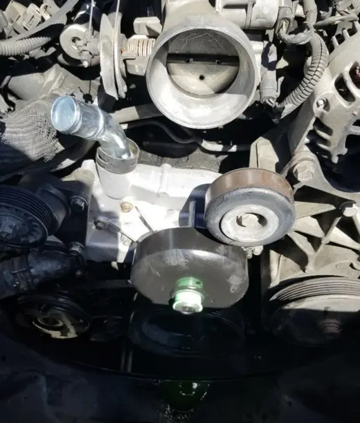 Front of the engine opened up: pulleys and water pump area